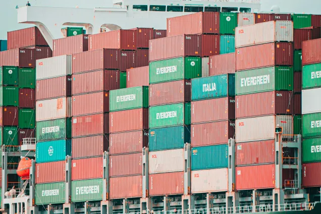 Container on a ship. Photo by Mika Baumeister on Unsplash.